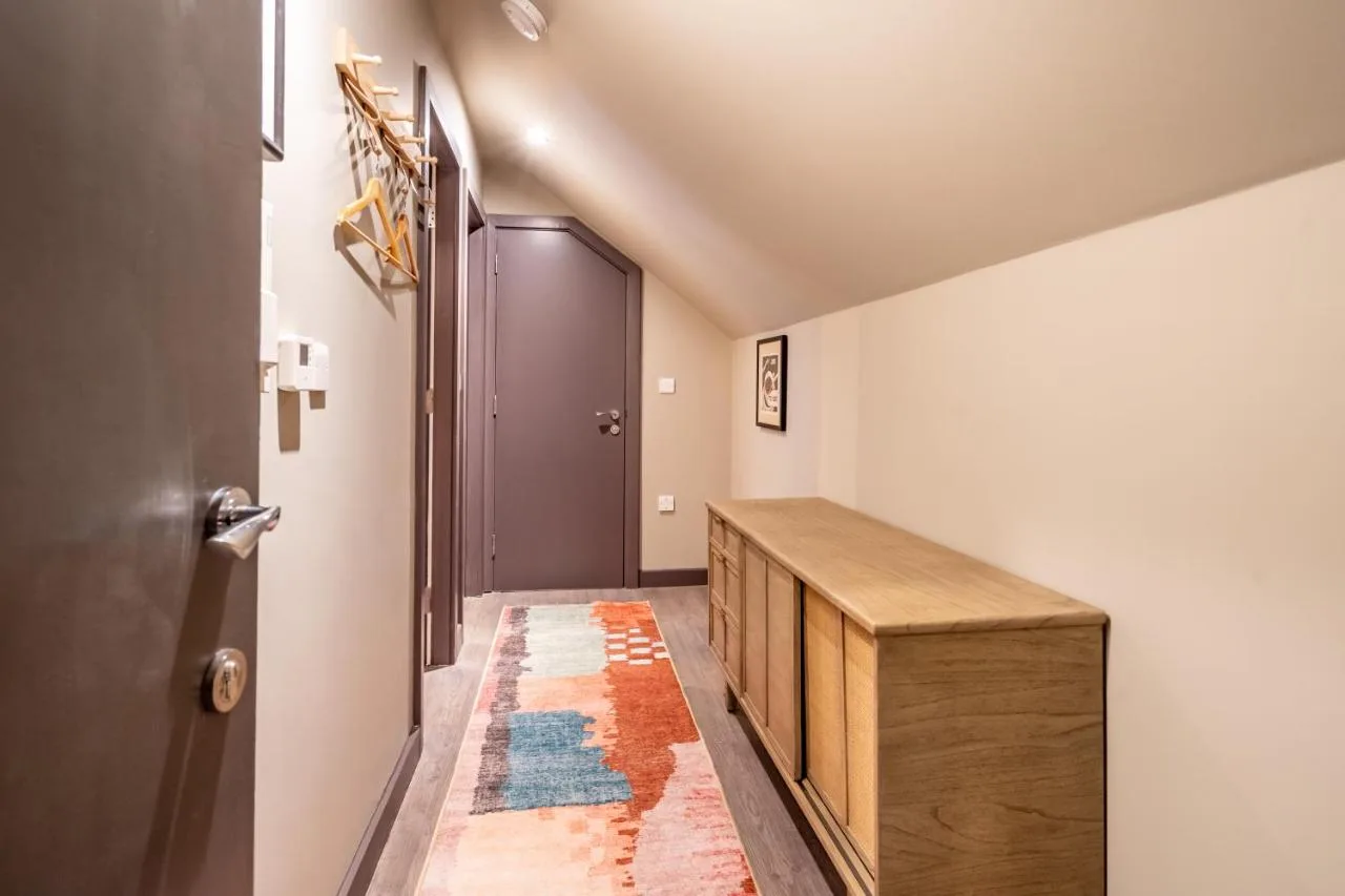 a hallway with a wooden console and a door at The Falcon in York